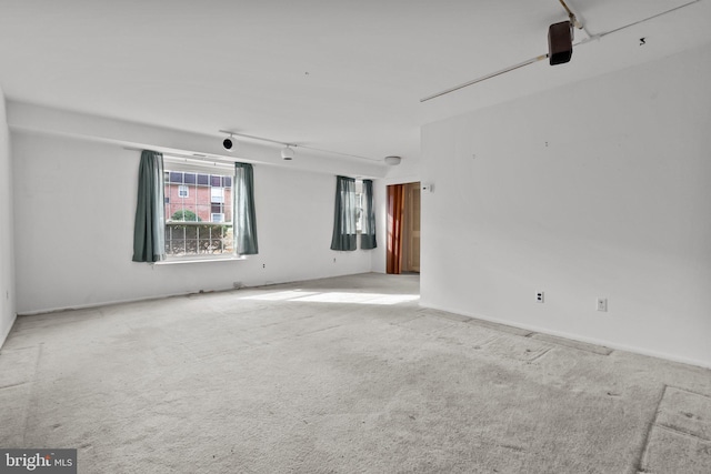 empty room featuring light colored carpet