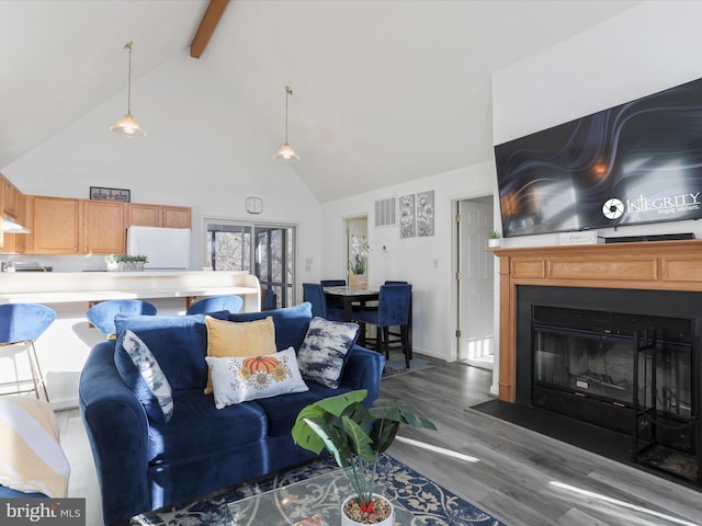 living room with beamed ceiling, high vaulted ceiling, and hardwood / wood-style flooring