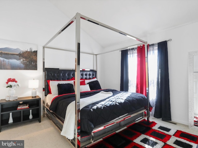 bedroom featuring lofted ceiling