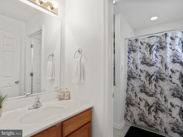 bathroom featuring tile patterned floors, a shower with curtain, and vanity