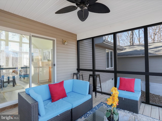 sunroom featuring ceiling fan