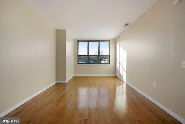 unfurnished room featuring light wood-type flooring