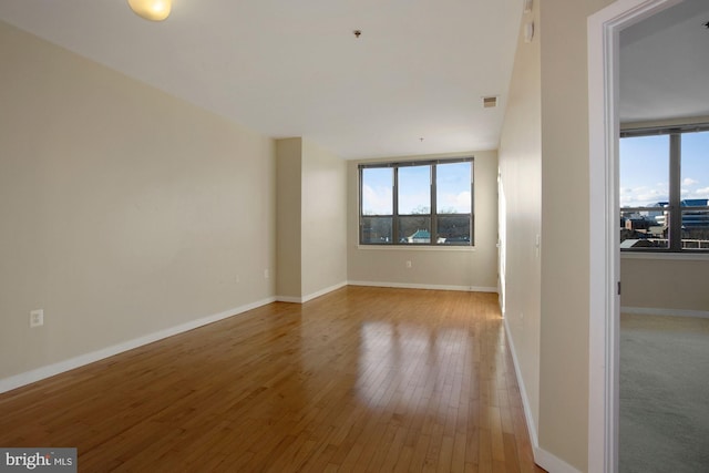 empty room with light wood-type flooring