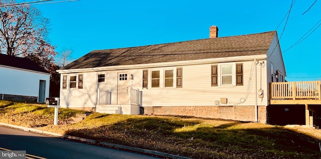 view of side of home featuring a yard