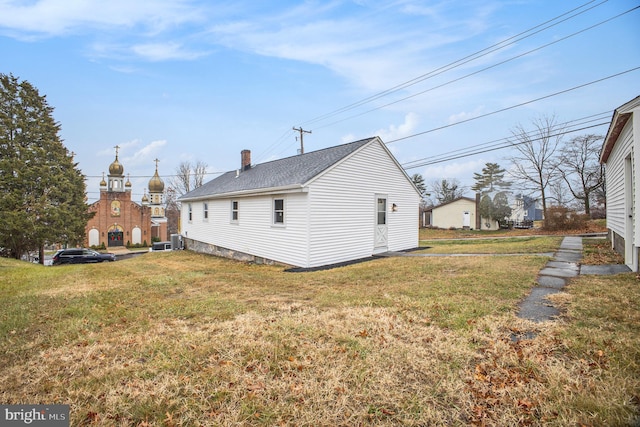 view of home's exterior with a yard