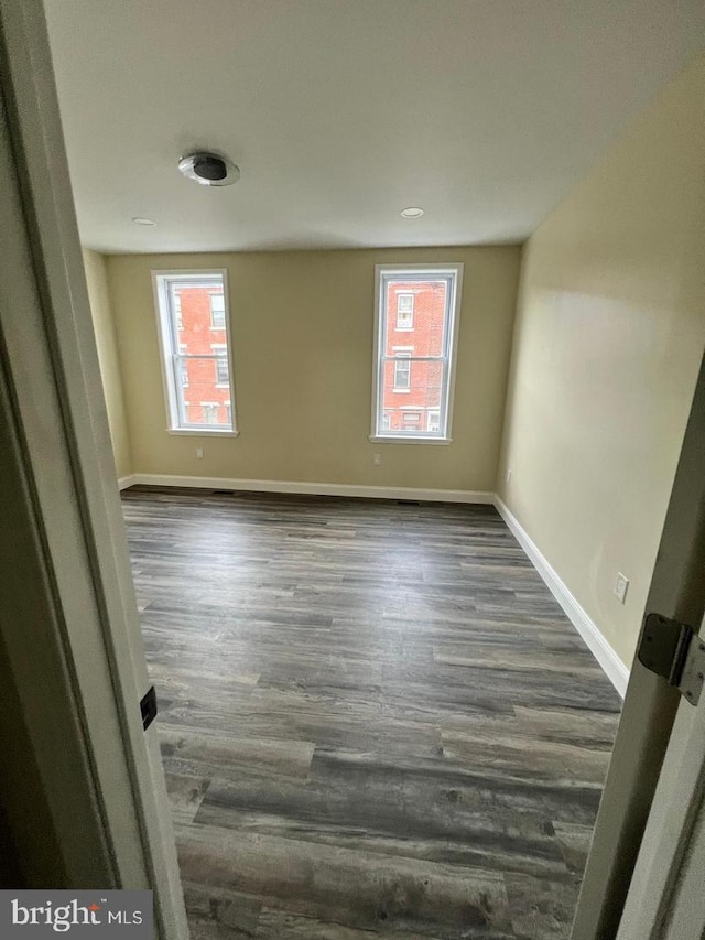 empty room featuring dark hardwood / wood-style floors