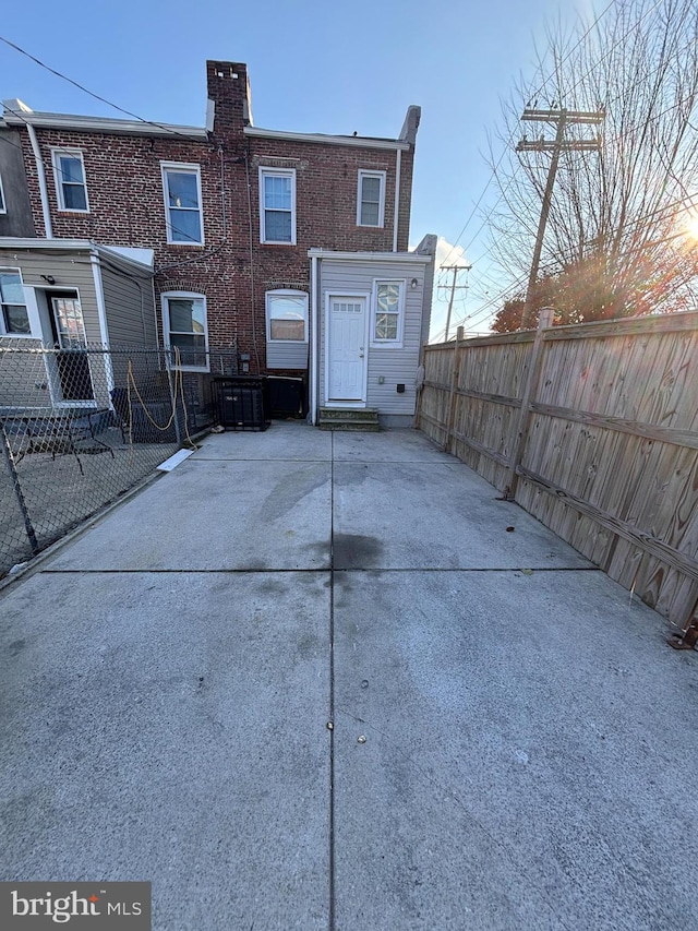 rear view of property featuring a patio area