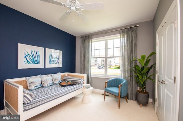 bedroom with carpet flooring, ceiling fan, and a closet