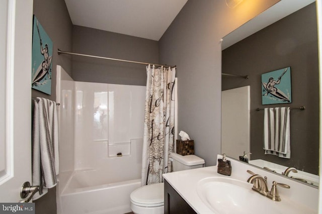 full bathroom featuring vanity, shower / bath combo, and toilet