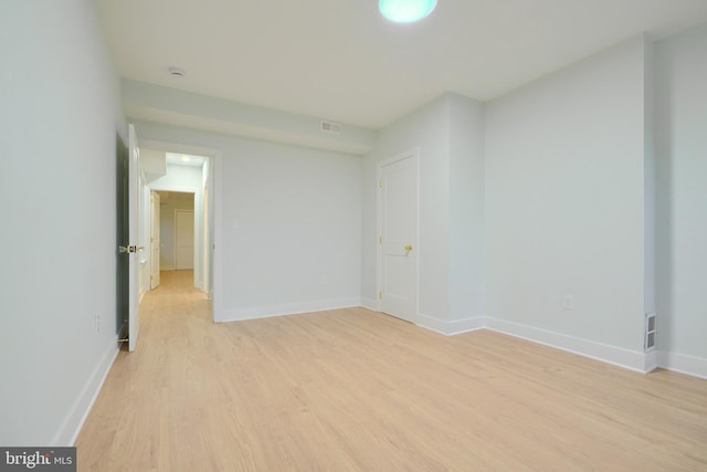 empty room with light hardwood / wood-style floors