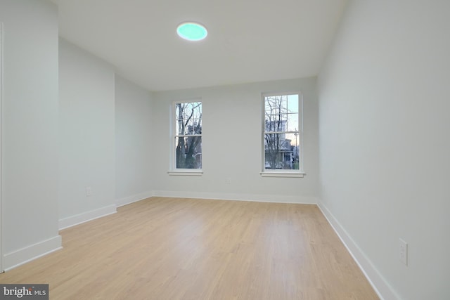 unfurnished room with light hardwood / wood-style flooring