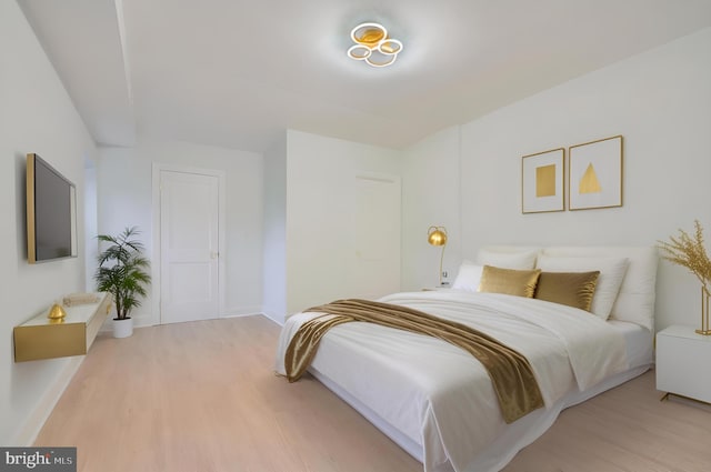 bedroom with light hardwood / wood-style floors