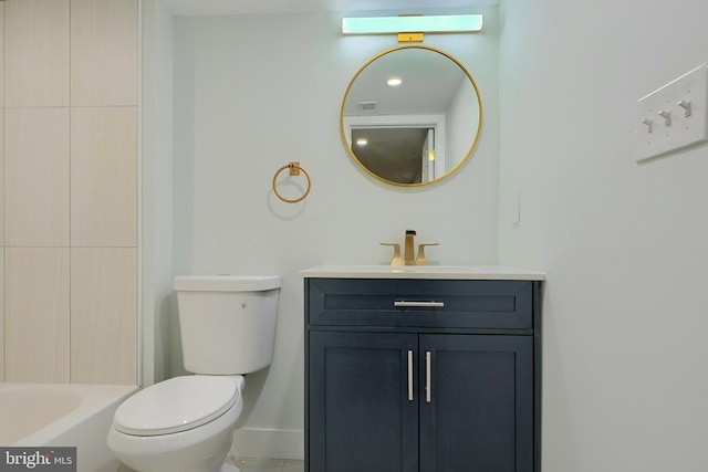 bathroom with vanity, a bath, and toilet