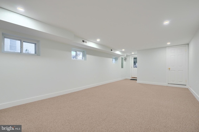 basement with light colored carpet