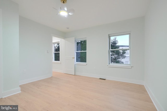 unfurnished room with light hardwood / wood-style floors