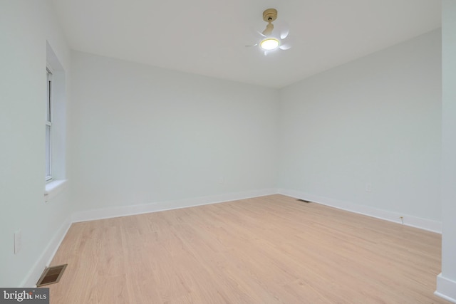 spare room with light hardwood / wood-style floors