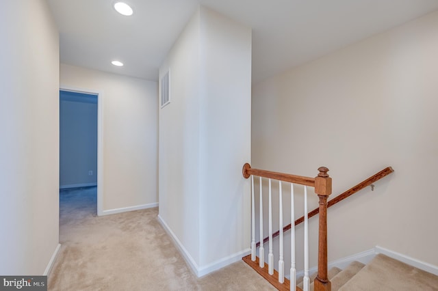 hallway with light carpet