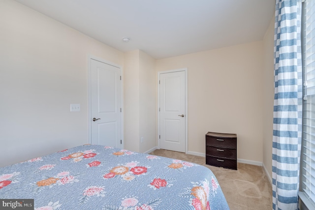 unfurnished bedroom with light carpet