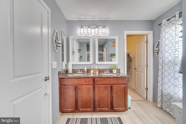 bathroom featuring vanity and hardwood / wood-style flooring