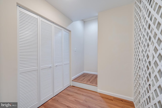 hallway with light wood-type flooring