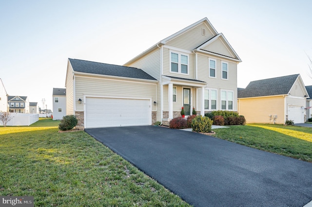 view of front facade featuring a front yard and a garage