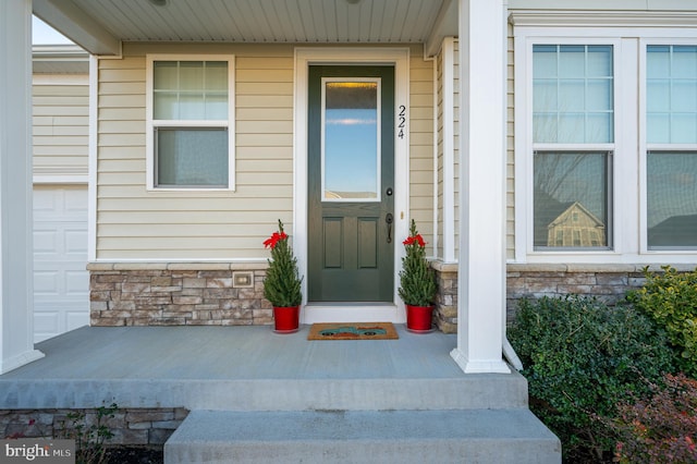 property entrance featuring covered porch