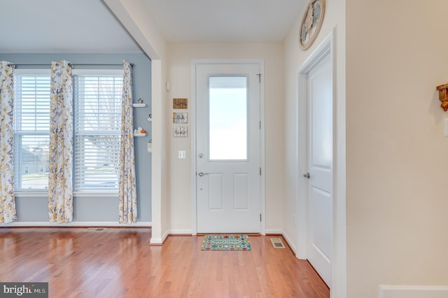 foyer entrance with light hardwood / wood-style flooring