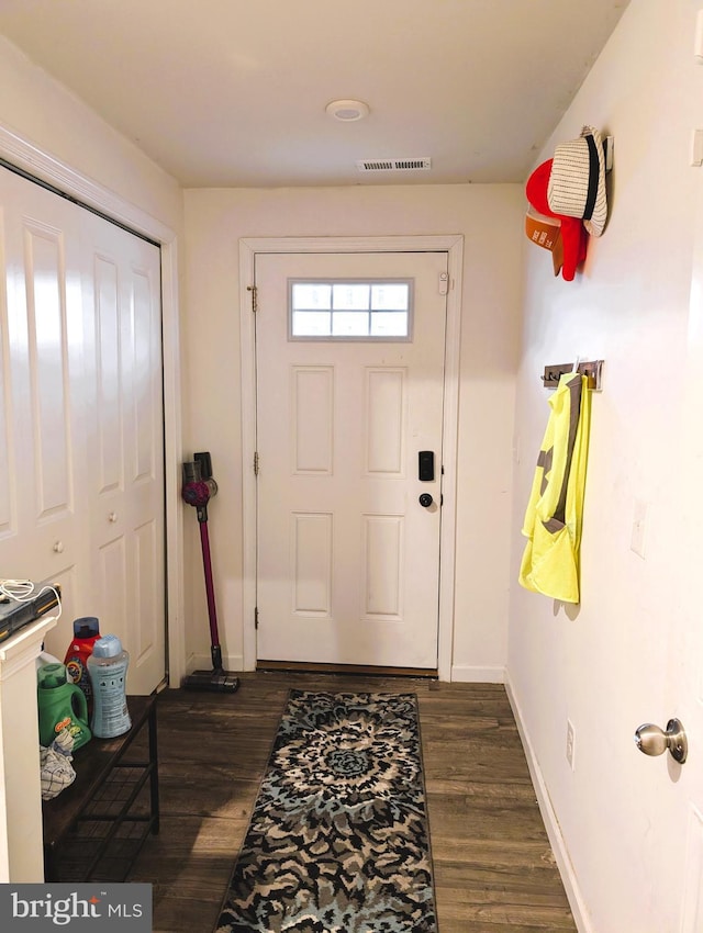 foyer with dark wood-type flooring