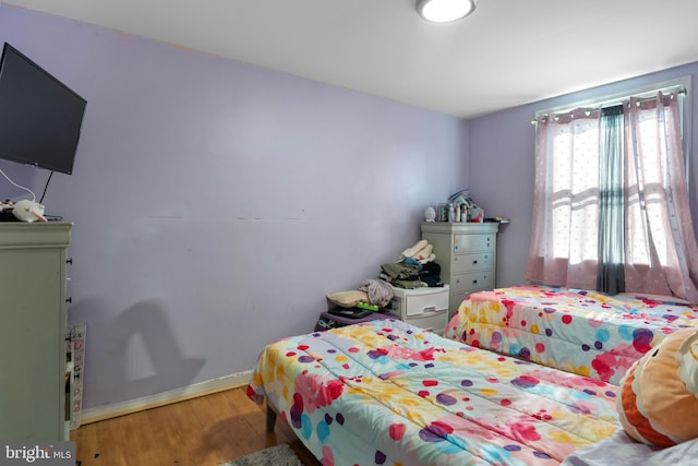 bedroom featuring hardwood / wood-style flooring