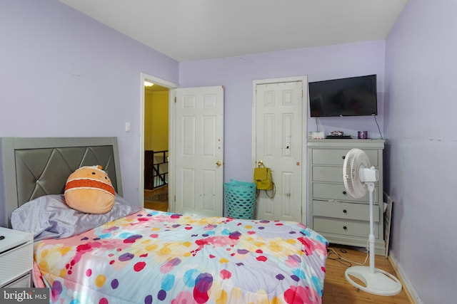 bedroom featuring hardwood / wood-style floors