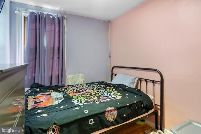 bedroom featuring hardwood / wood-style flooring