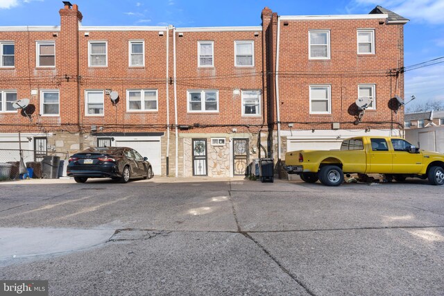 102 W Walnut Park Dr, Philadelphia, PA 19120 - view of property with driveway and a garage