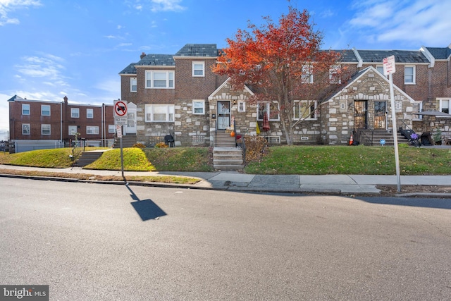 102 W Walnut Park Dr, Philadelphia, PA 19120 - view of property featuring stone siding and a front lawn