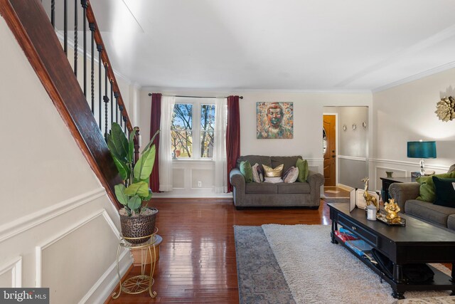 102 W Walnut Park Dr, Philadelphia, PA 19120 - living area featuring ornamental molding, stairs, hardwood / wood-style floors, a decorative wall, and wainscoting