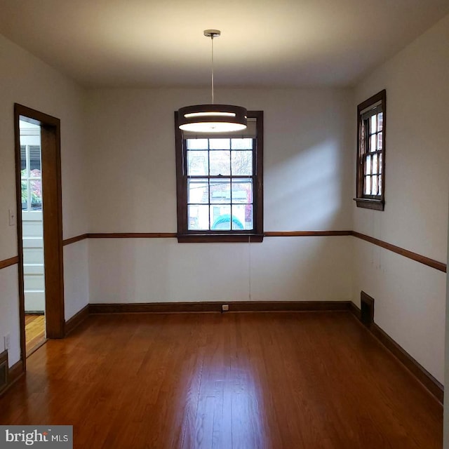 spare room featuring hardwood / wood-style flooring