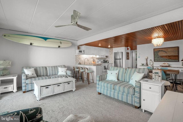 6803 Atlantic Ave Unit 3K, Ocean City, MD 21842 - living room featuring a ceiling fan and light colored carpet