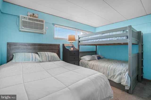 carpeted bedroom featuring a wall mounted AC