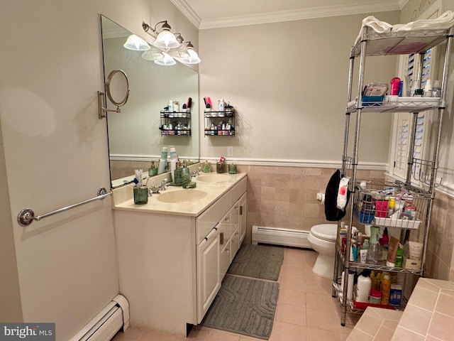 bathroom featuring a baseboard heating unit, tile patterned floors, crown molding, toilet, and tile walls