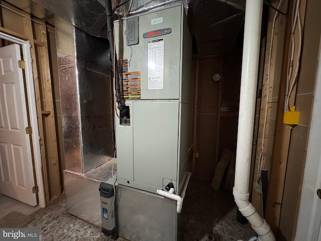 utility room with heating unit