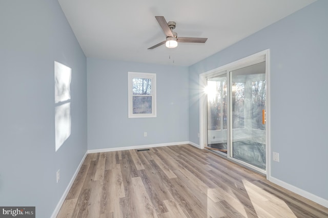 spare room with light hardwood / wood-style floors and ceiling fan