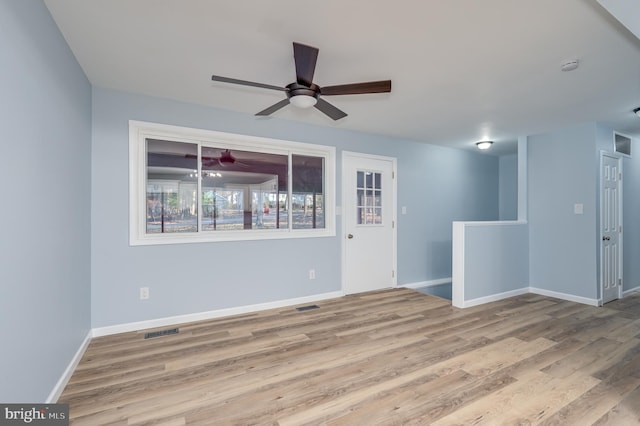 unfurnished room with ceiling fan and light wood-type flooring