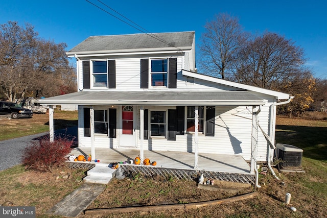 view of front of property featuring cooling unit and covered porch