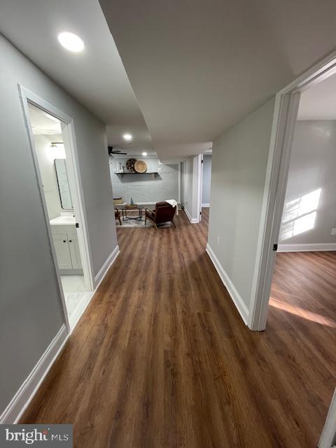 hallway featuring dark hardwood / wood-style flooring