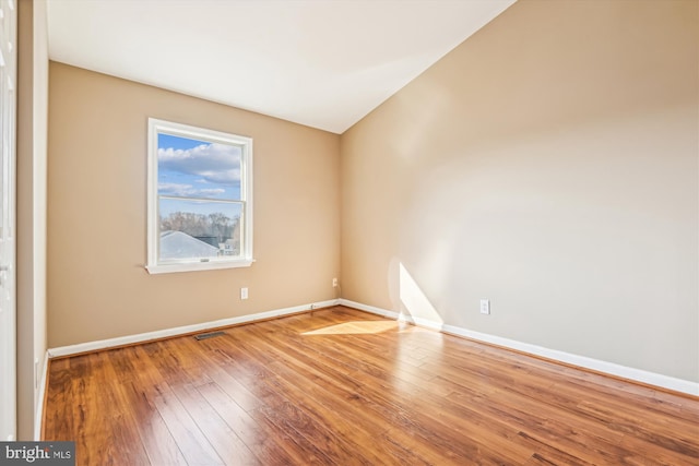 unfurnished room featuring wood-type flooring