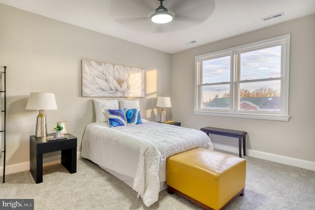 bedroom with light colored carpet and ceiling fan