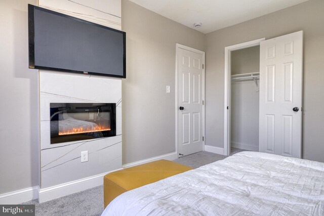 carpeted bedroom with a closet