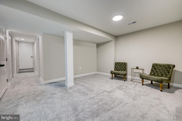 living area featuring light colored carpet