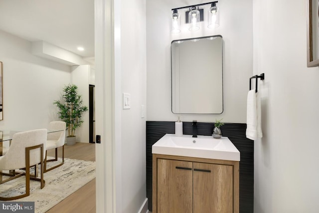 bathroom featuring wood-type flooring and vanity