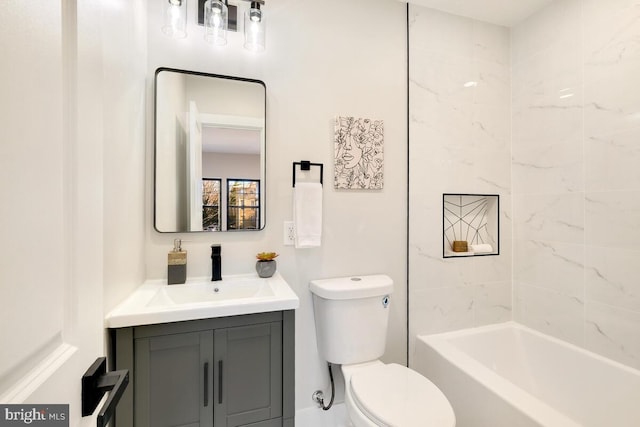 full bathroom with vanity, toilet, and tiled shower / bath