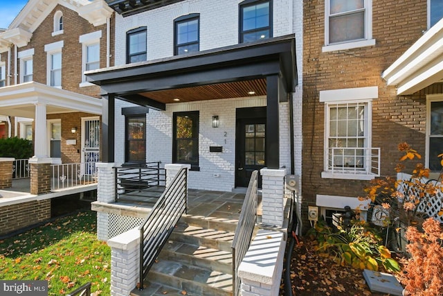 entrance to property with a porch